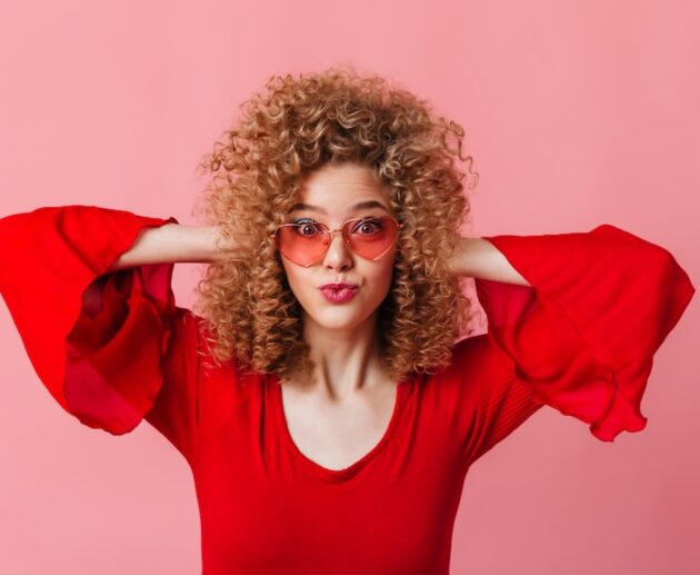 close-up-portrait-curly-blonde-pink-sun-glasses-red-top-surprised-pink-space-630x517 Home
